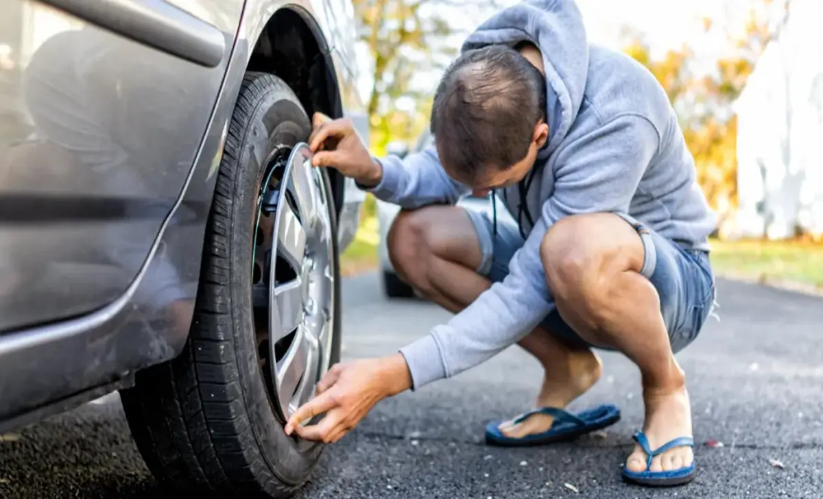 Remove The Damaged Tire's Hubcap Or Wheel Cover